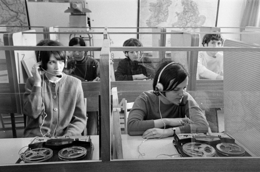 Young people in booths learning a foreign language in Budapest in 1971
