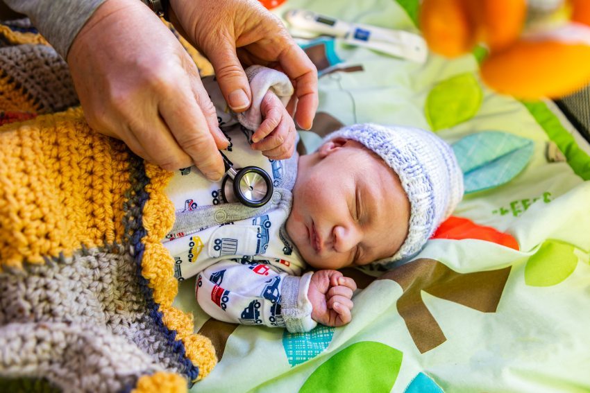 a baby being examined