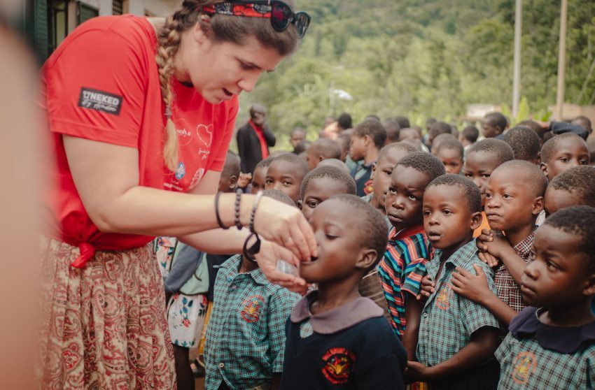 Zsófia Szilágyi-Könczöl distributing medicines during the annual anthelmintic treatment to children attending the association's school, October 2023, Manafwa, Uganda
