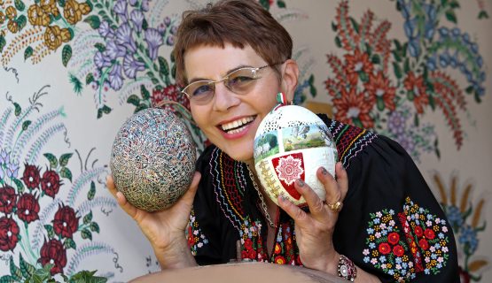 Kati Zsigone with two of her decorated eggs