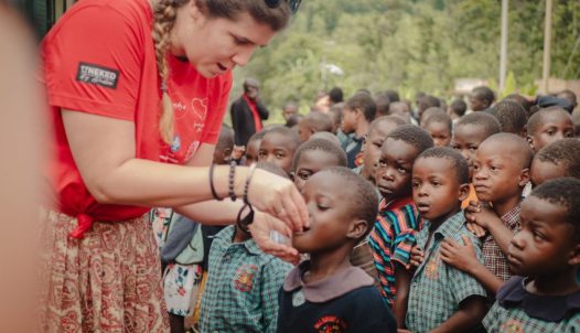 Zsófia Szilágyi-Könczöl distributing medicines during the annual anthelmintic treatment to children attending the association's school, October 2023, Manafwa, Uganda