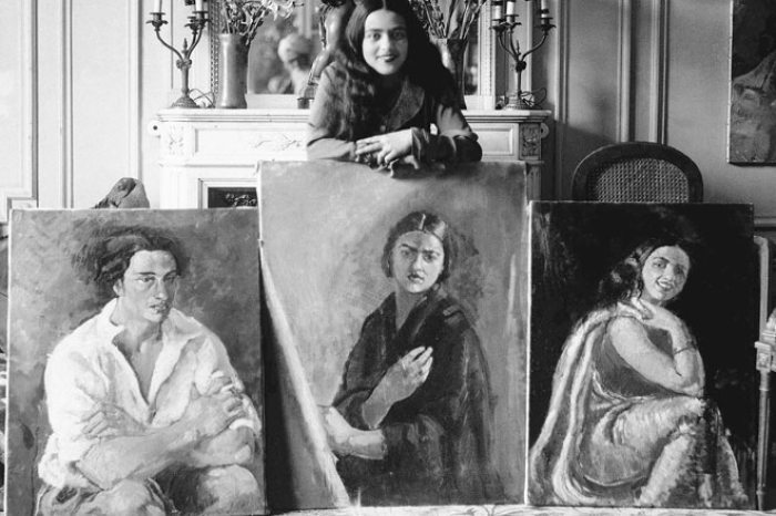 Amrita Shér-Gil with three of her paintings