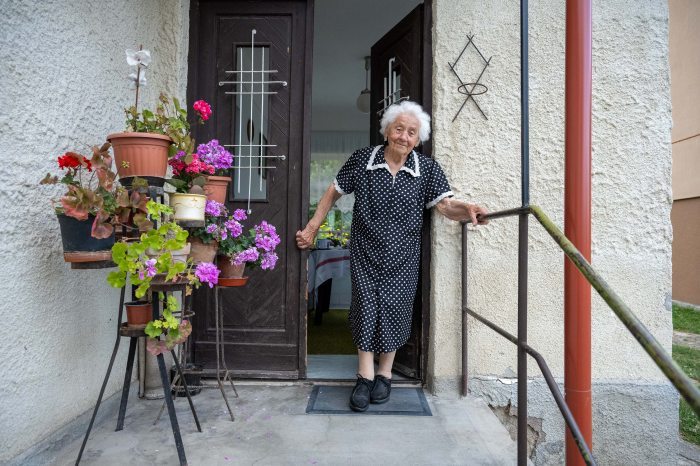 Sári néni in front of her house today