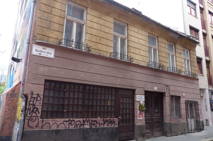 The house in Budapest where József Schneider's card-making workshop used to be, with the plaque on it