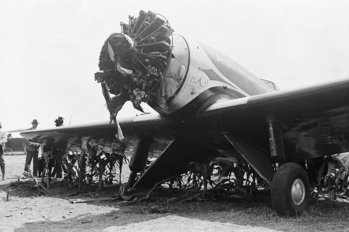 The Lockheed Sirius aircraft damaged during the emergency landing on the cornfield near the two villages