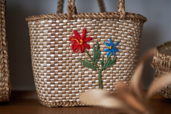 bag woven of cattails and decorated woth flowers