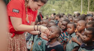 Zsófia Szilágyi-Könczöl distributing medicines during the annual anthelmintic treatment to children attending the association's school, October 2023, Manafwa, Uganda