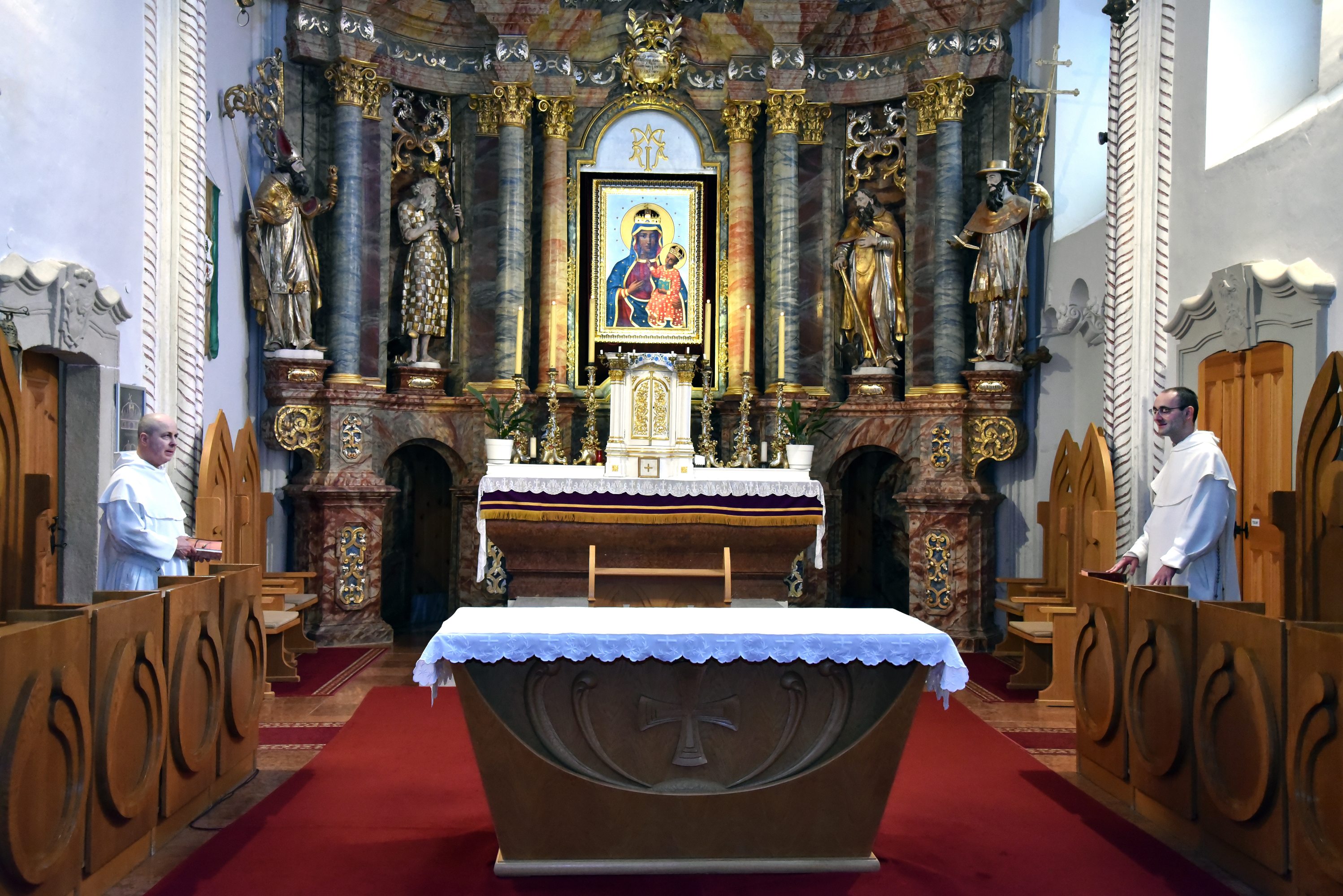 Pauline monks praying inside a church