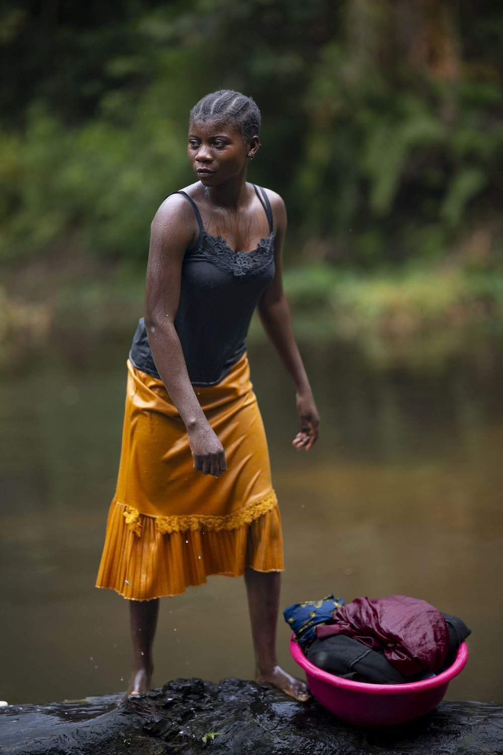 A girl in a river in the Congo