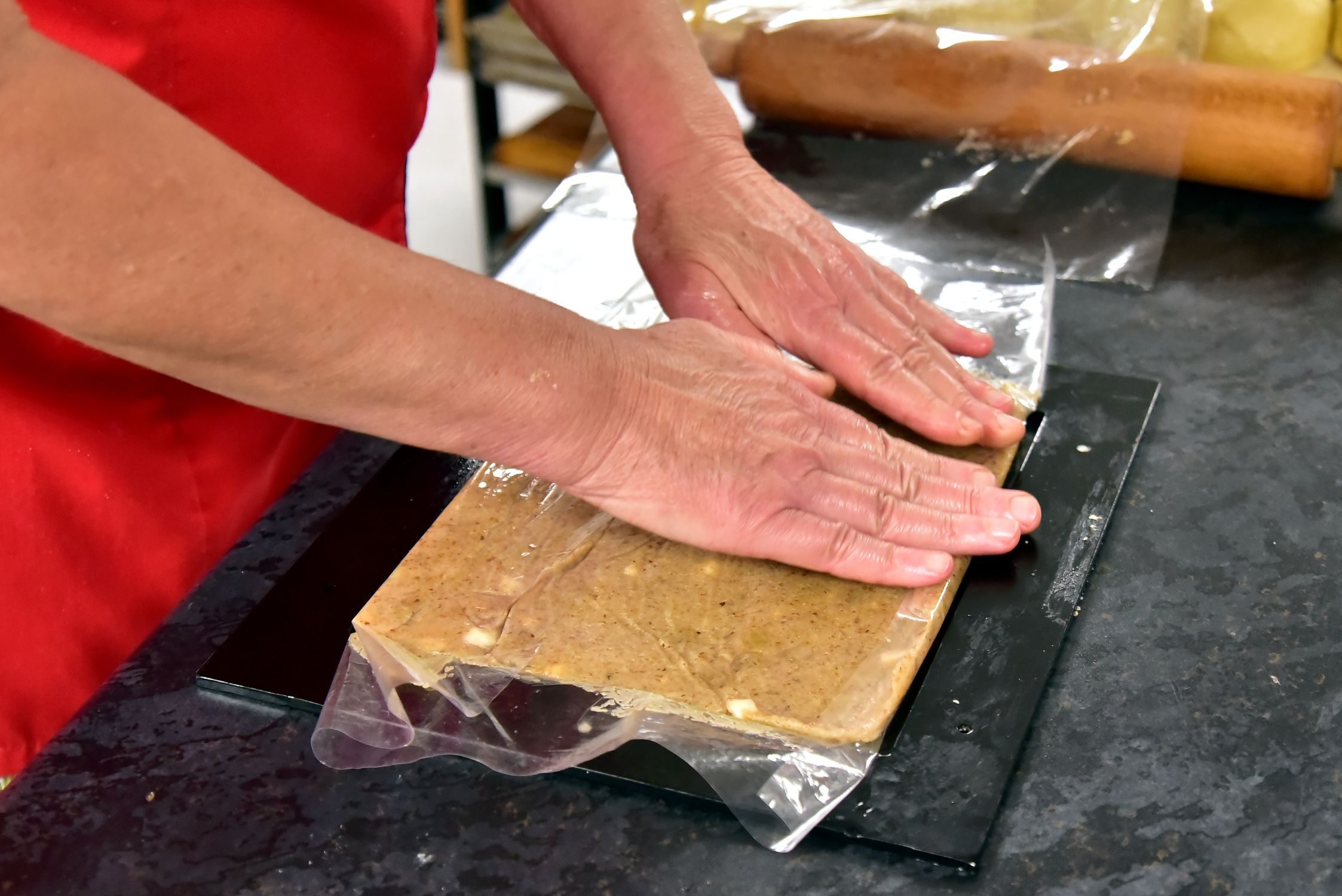 flattening the filling between two sheets of foil