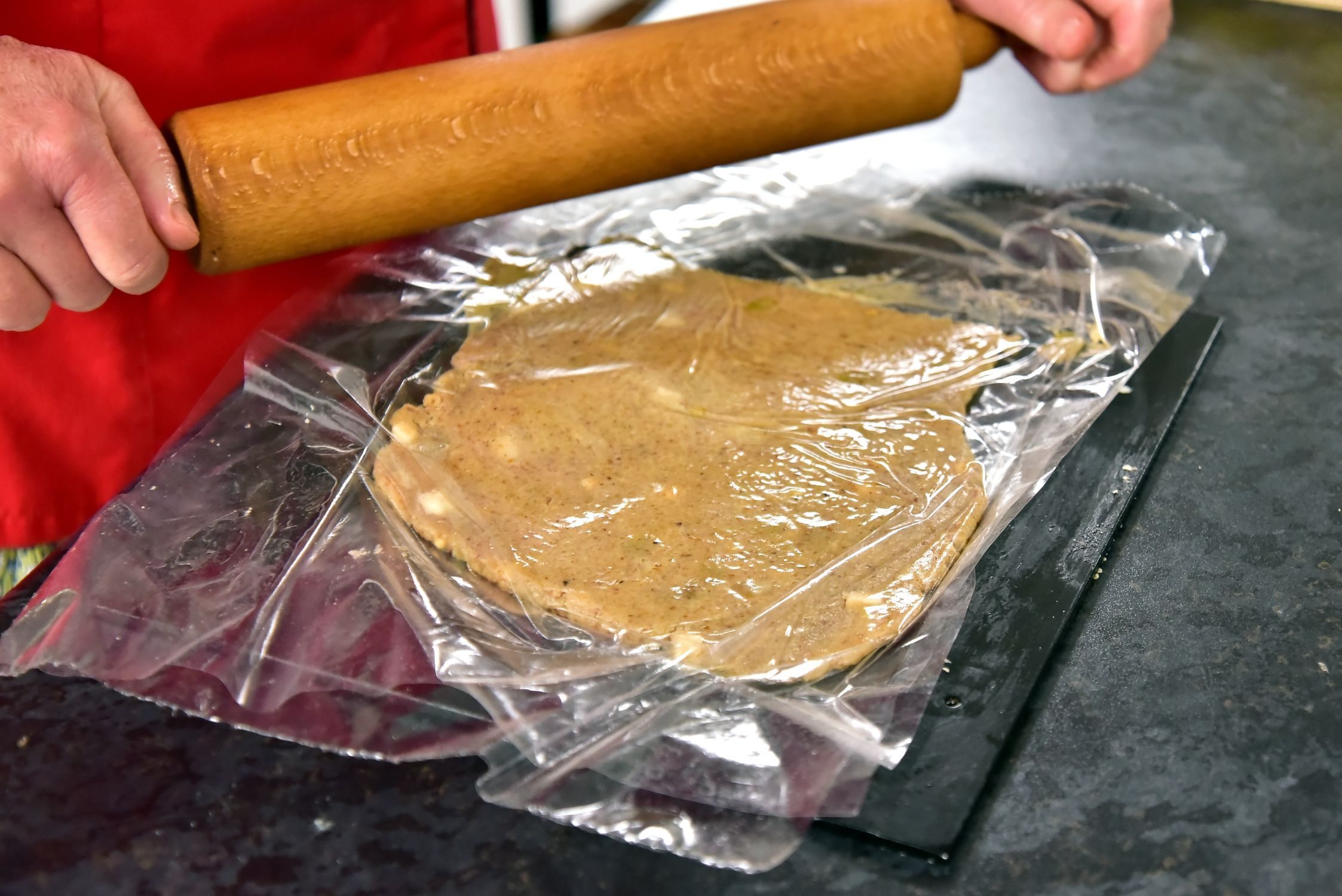 flattening the filling between two sheets of foil