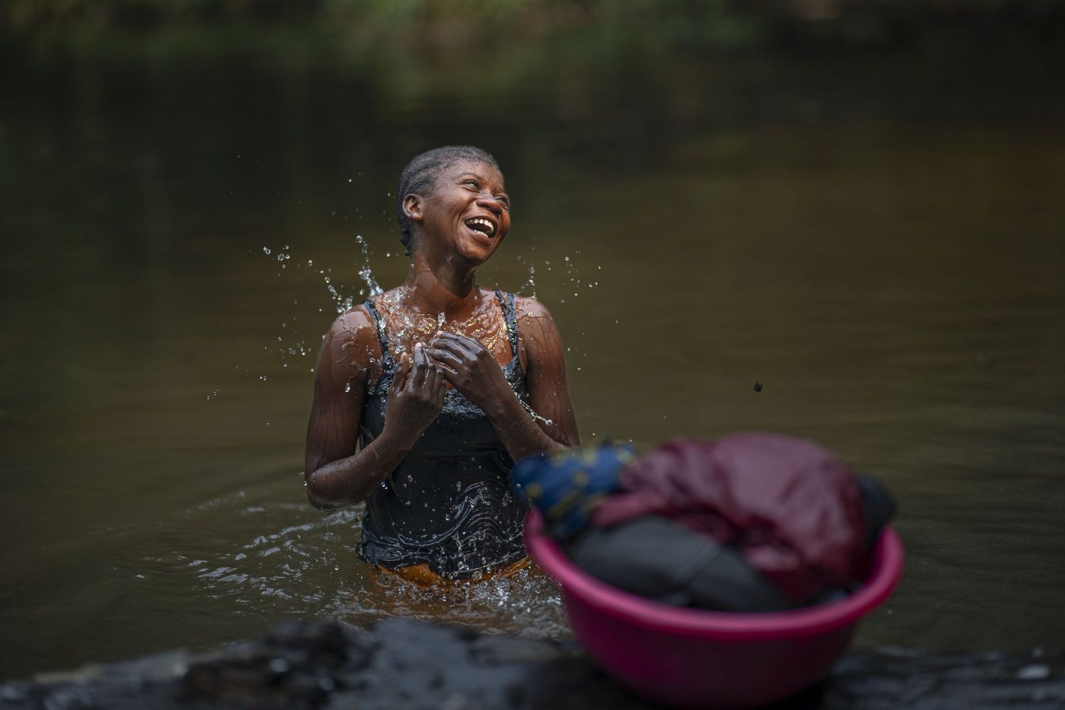 A girl in a river in the Congo