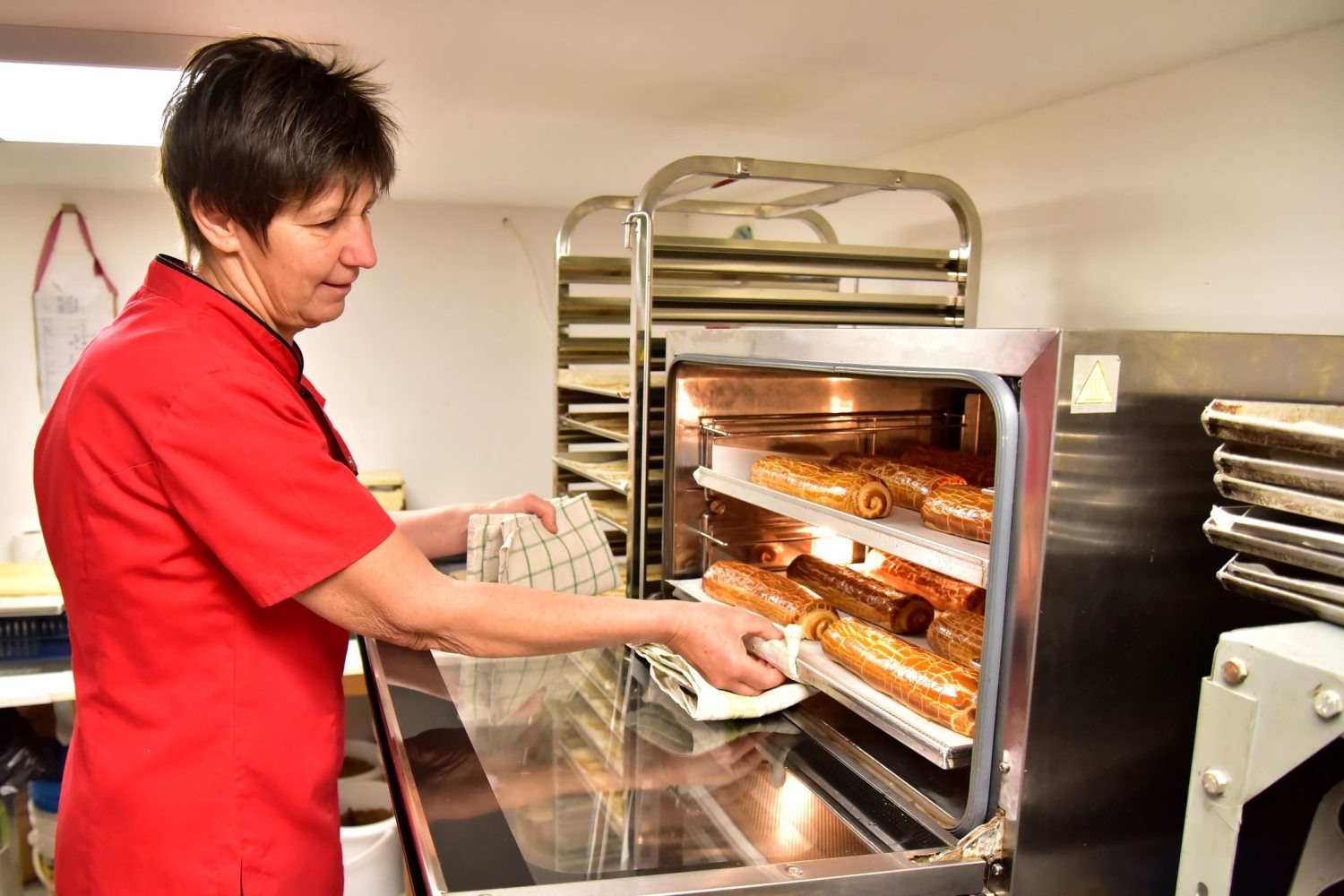 putting the rolls into the oven